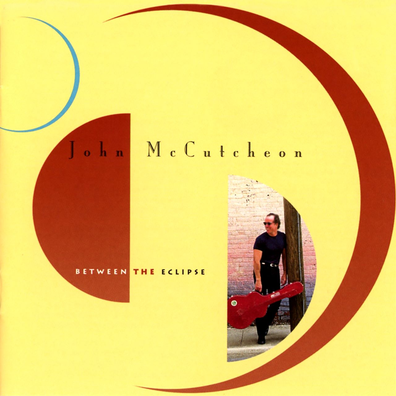 John McCutcheon – Between The Eclipse cover album